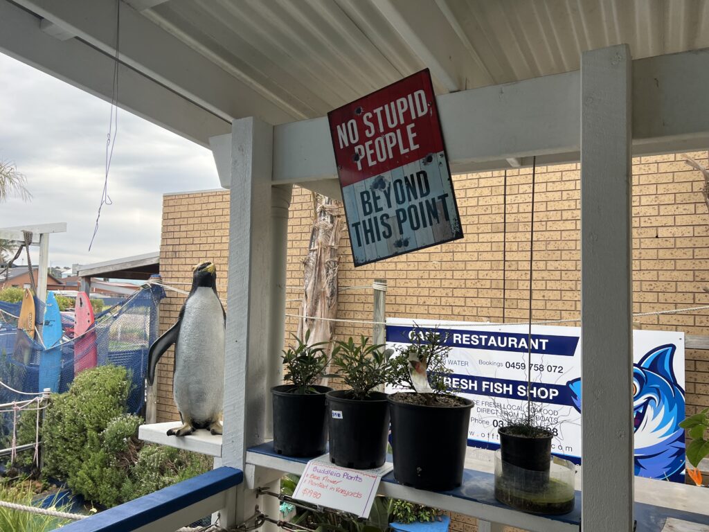 Ruff Ruff Reviews - Footbridge Mini Golf, Lolly Shop & Ice Cream Shack, Lakes Entrance - Ralph impressed with Cheeky sign
