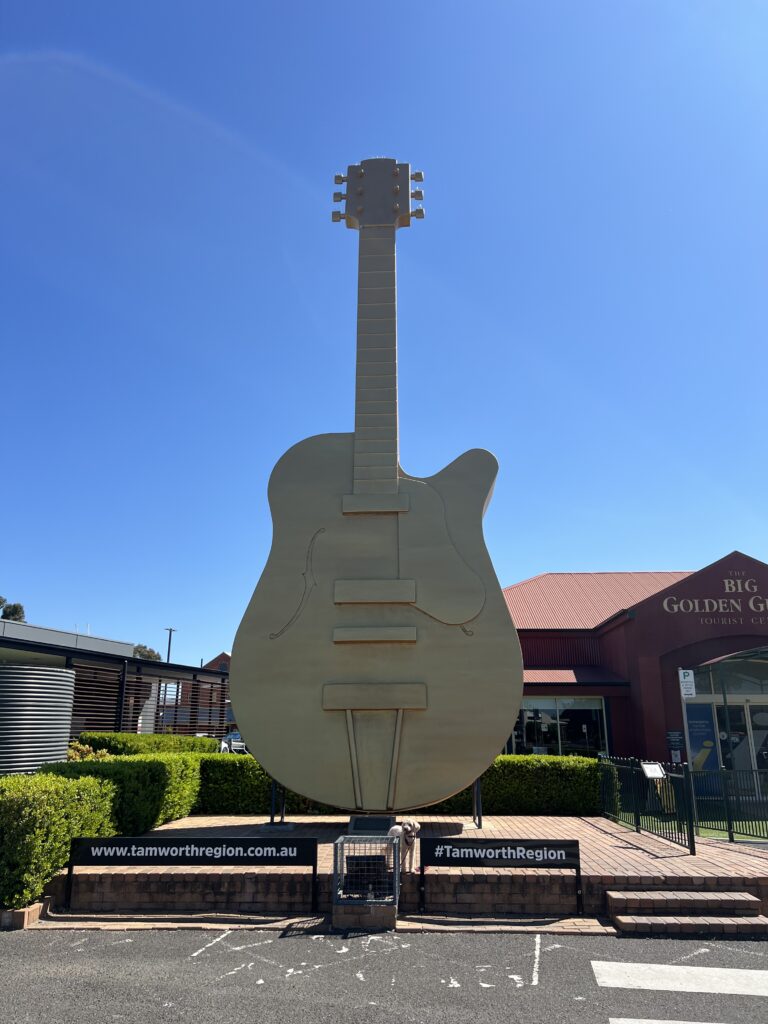 Ruff Ruff Reviews - Big Golden Guitar Cafe and Visitor Information Centre, Tamworth, New South Wales - Ralph in front of Golden Guitar